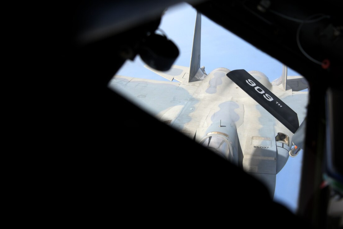 A KC-135 Stratotanker assigned to the 909th Air Refueling Squadron conducts air-to-air refueling with a 67th Fighter Squadron F-15C Eagle during a training exercise July 8, 2020, off the coast of Okinawa, Japan. The 909th ARS is the premier force for air refueling U.S. and allied aircraft during contingencies and humanitarian missions throughout the U.S. Indo-Pacific Theater. USINDOPACOM has the capacity to conduct training and exercises focused on the full spectrum of military operations, from combat to humanitarian assistance and disaster relief, anywhere throughout the Indo-Pacific region. (U.S. Air Force photo by Airman 1st Class Rebeckah Medeiros)