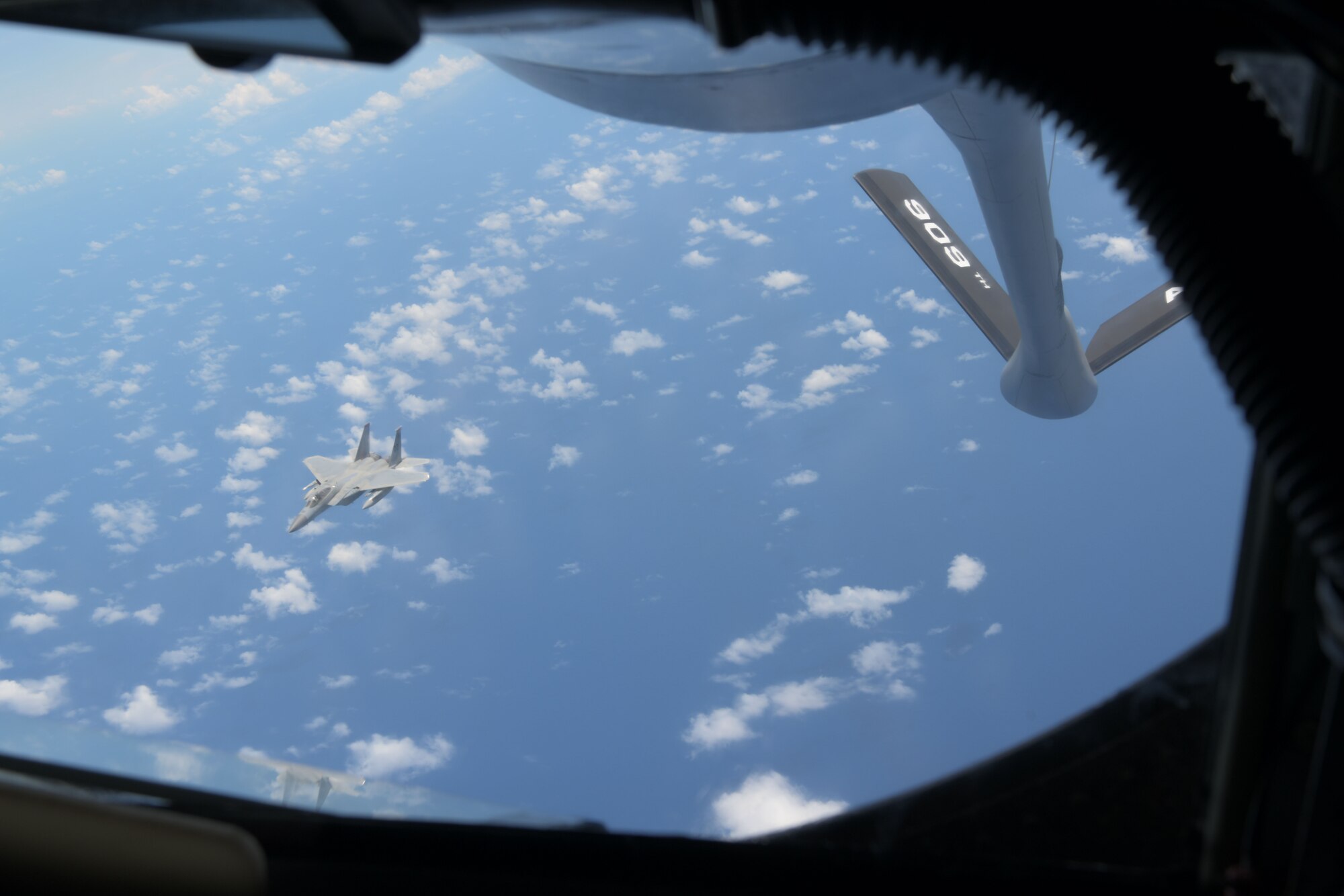 A KC-135 Stratotanker assigned to the 909th Air Refueling Squadron conducts air-to-air refueling with a 67th Fighter Squadron F-15C Eagle during a training exercise July 8, 2020, off the coast of Okinawa, Japan. The 909th ARS is the premier force for air refueling U.S. and allied aircraft during contingencies and humanitarian missions throughout the U.S. Indo-Pacific Theater. USINDOPACOM has the capacity to conduct training and exercises focused on the full spectrum of military operations, from combat to humanitarian assistance and disaster relief, anywhere throughout the Indo-Pacific region. (U.S. Air Force photo by Airman 1st Class Rebeckah Medeiros)