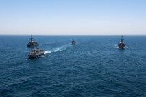 200618-N-KZ419-1009 ARABIAN GULF (June 18, 2020) Ships from Saudi Arabia, the U.K, and U.S. sail in formation during a mine countermeasures interoperability exercise in the U.S. 5th Fleet area of operations. The 5th Fleet area of operations encompasses about 2.5 million square miles of water area and includes the Arabian Gulf, Gulf of Oman, Red Sea and parts of the Indian Ocean. The expanse is comprised of 20 countries and includes three chokepoints, critical to the free flow of global commerce. (U.S. Navy photo by Mass Communication Specialist 3rd Class Dawson Roth)