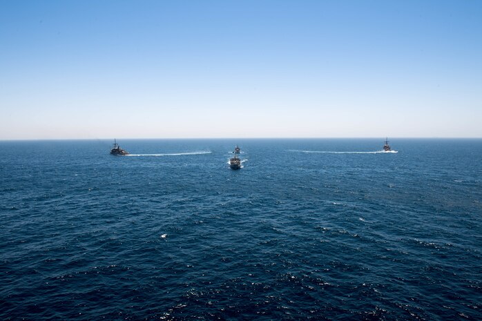 200618-N-KZ419-1010 ARABIAN GULF (June 18, 2020) Ships from Saudi Arabia, the U.K, and U.S. sail in formation during a mine countermeasures interoperability exercise in the U.S. 5th Fleet area of operations. The 5th Fleet area of operations encompasses about 2.5 million square miles of water area and includes the Arabian Gulf, Gulf of Oman, Red Sea and parts of the Indian Ocean. The expanse is comprised of 20 countries and includes three chokepoints, critical to the free flow of global commerce. (U.S. Navy photo by Mass Communication Specialist 3rd Class Dawson Roth)
