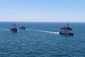 200618-N-KZ419-1006 ARABIAN GULF (June 18, 2020) Ships from Saudi Arabia, the U.K, and U.S. sail in formation during a mine countermeasures interoperability exercise in the U.S. 5th Fleet area of operations. The 5th Fleet area of operations encompasses about 2.5 million square miles of water area and includes the Arabian Gulf, Gulf of Oman, Red Sea and parts of the Indian Ocean. The expanse is comprised of 20 countries and includes three chokepoints, critical to the free flow of global commerce. (U.S. Navy photo by Mass Communication Specialist 3rd Class Dawson Roth)