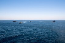 200618-N-KZ419-1008 ARABIAN GULF (June 18, 2020) Ships from Saudi Arabia, the U.K, and U.S. sail in formation during a mine countermeasures interoperability exercise in the U.S. 5th Fleet area of operations. The 5th Fleet area of operations encompasses about 2.5 million square miles of water area and includes the Arabian Gulf, Gulf of Oman, Red Sea and parts of the Indian Ocean. The expanse is comprised of 20 countries and includes three chokepoints, critical to the free flow of global commerce. (U.S. Navy photo by Mass Communication Specialist 3rd Class Dawson Roth)