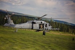 An Alaska Air National Guard HH-60 Pave Hawk, from the 210th Rescue Squadron, performs a simulated search and rescue pattern in Alaska. The 210th Rescue Squadron is part of a network of search-and-rescue organizations that save hundreds of lives in and around Alaska every year.