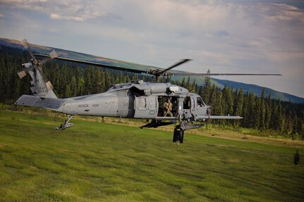 An Alaska Air National Guard HH-60 Pave Hawk, from the 210th Rescue Squadron, performs a simulated search and rescue pattern in Alaska. The 210th Rescue Squadron is part of a network of search-and-rescue organizations that save hundreds of lives in and around Alaska every year.