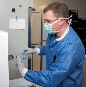 Army Spc. David Pyke, medical laboratory technician, removes patient samples from a rapid COVID-19 polymerase chain reaction testing platform at Brooke Army Medical Center at Joint Base San Antonio-Fort Sam Houston April 9.