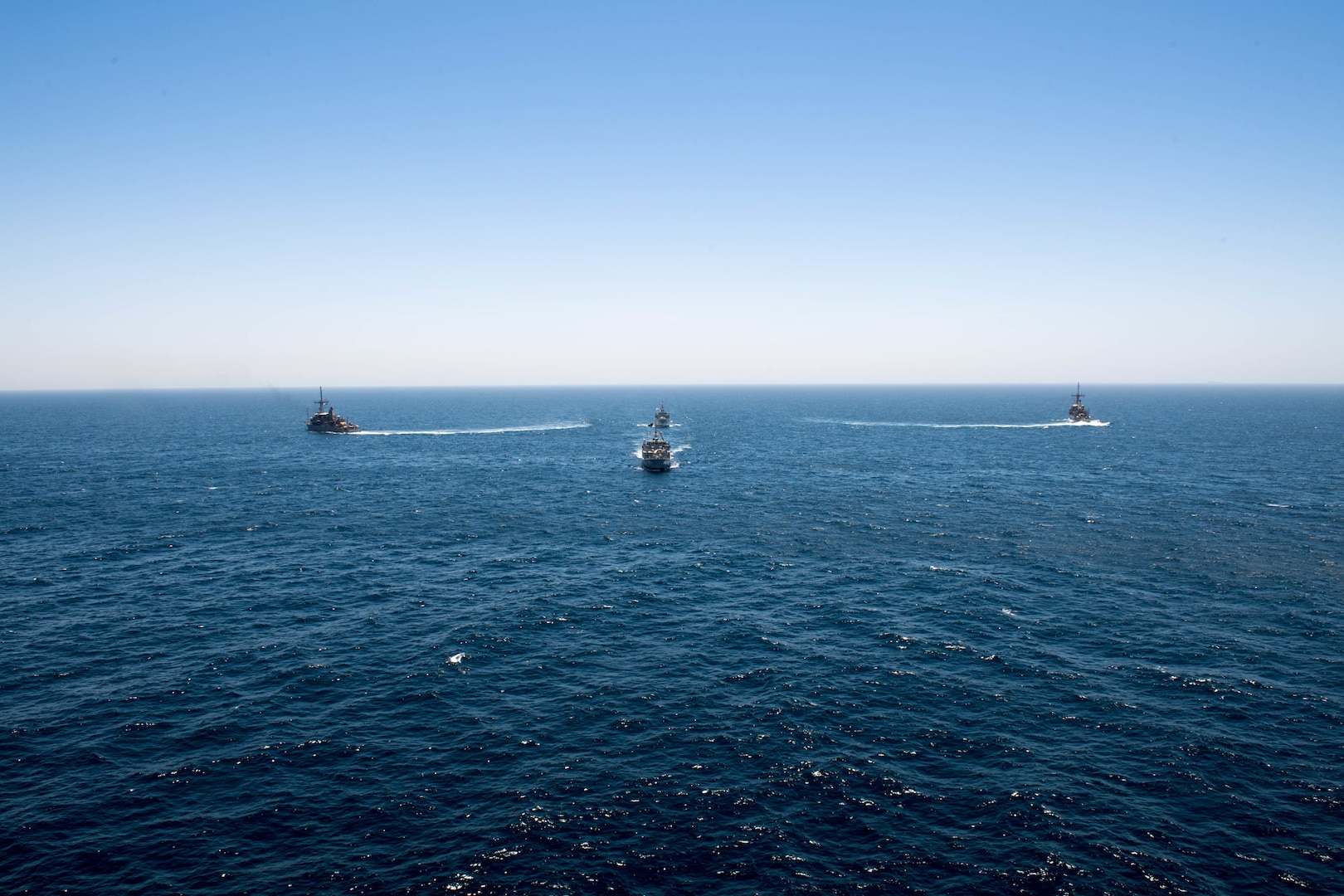 200618-N-KZ419-1010 ARABIAN GULF (June 18, 2020) Ships from Saudi Arabia, the U.K, and U.S. sail in formation during a mine countermeasures interoperability exercise in the U.S. 5th Fleet area of operations. The 5th Fleet area of operations encompasses about 2.5 million square miles of water area and includes the Arabian Gulf, Gulf of Oman, Red Sea and parts of the Indian Ocean. The expanse is comprised of 20 countries and includes three chokepoints, critical to the free flow of global commerce. (U.S. Navy photo by Mass Communication Specialist 3rd Class Dawson Roth)