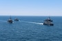 ARABIAN GULF (June 18, 2020) Ships from Saudi Arabia, the U.K, and U.S. sail in formation during a mine countermeasures interoperability exercise in the U.S. 5th Fleet area of operations. The 5th Fleet area of operations encompasses about 2.5 million square miles of water area and includes the Arabian Gulf, Gulf of Oman, Red Sea and parts of the Indian Ocean. The expanse is comprised of 20 countries and includes three chokepoints, critical to the free flow of global commerce. (U.S. Navy photo by Mass Communication Specialist 3rd Class Dawson Roth)