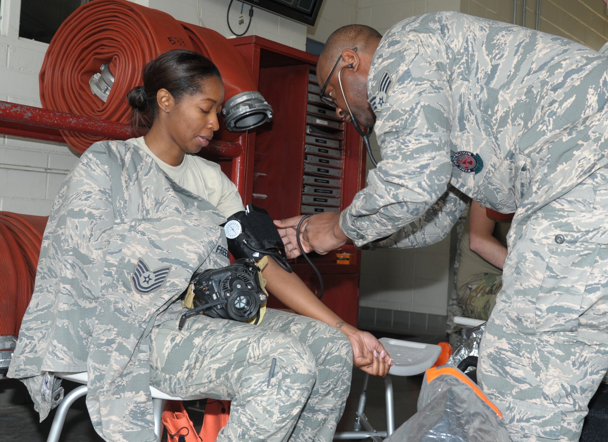 42nd Medical Group airman takes blood pressure of biochemical engineer.