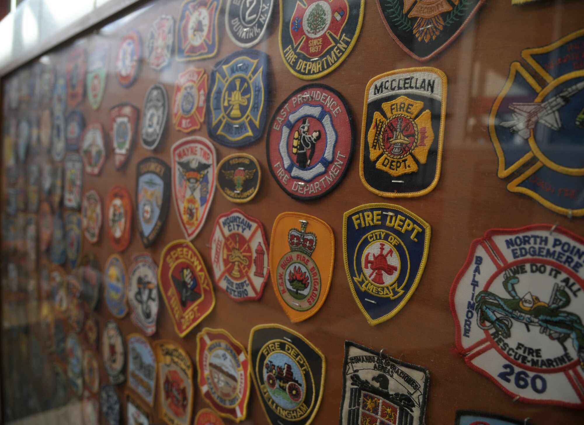 Patches displayed from various fire departments.