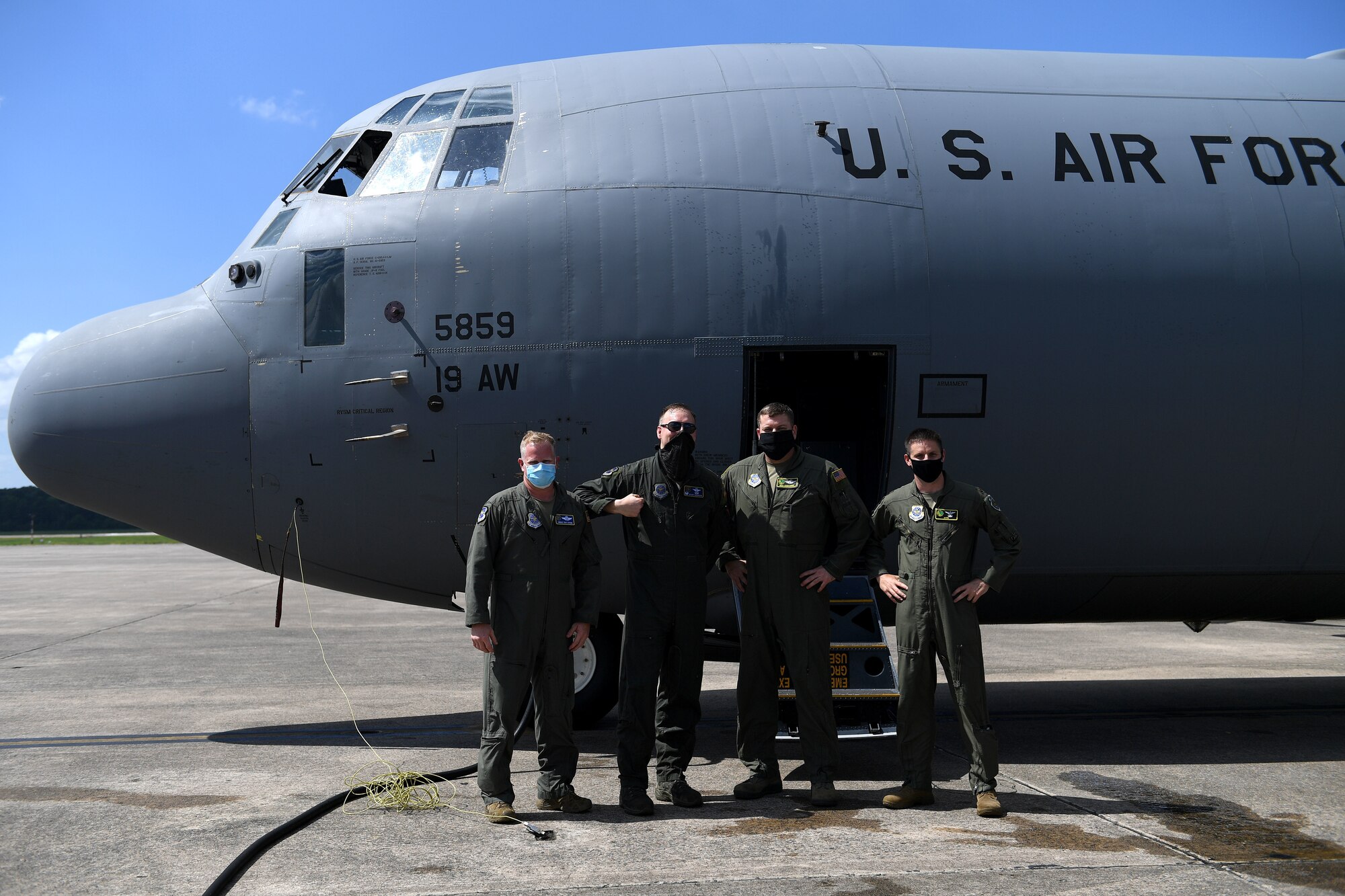 Col. Shane Haughian, 19th Operations Group commander, poses for a crew photo after exiting a C-130J Super Hercules upon completing his final flight as commander of the group at Little Rock Air Force Base, Arkansas, July 8, 2020. (U.S. Air Force photo by Senior Airman Kristine Gruwell)