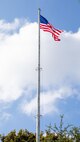 Newly restored flagpole flies the National Ensign over Norfolk Naval Shipyard.