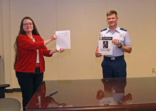 The 17th Training Group Director of Education Angelic Crawford and U.S. Air Force Col. Thomas Coakley, 17th TRG commander, presented the signed James H. Doolittle Fellowship Program memorandum of understanding at the Brandenburg Hall, on Goodfellow Air Force Base, Texas, June 16, 2020. This fellowship program supports the National Defense Strategy to build a more lethal and ready Air Force, by providing professional educators who deliver