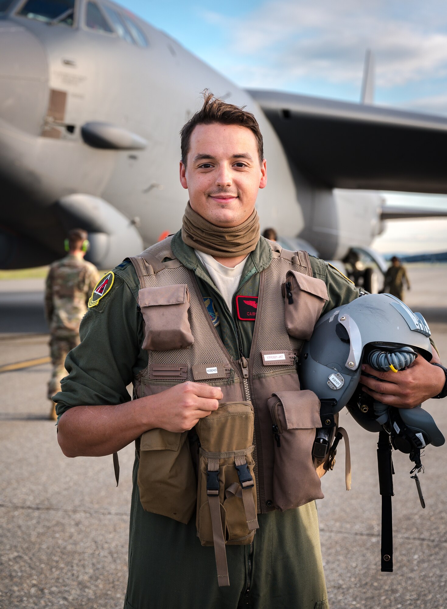 A portrait of Capt. Nathan Cooper, 96th Bomb Squadron pilot, poses for a photo in front of a B-52H Stratofortress.
