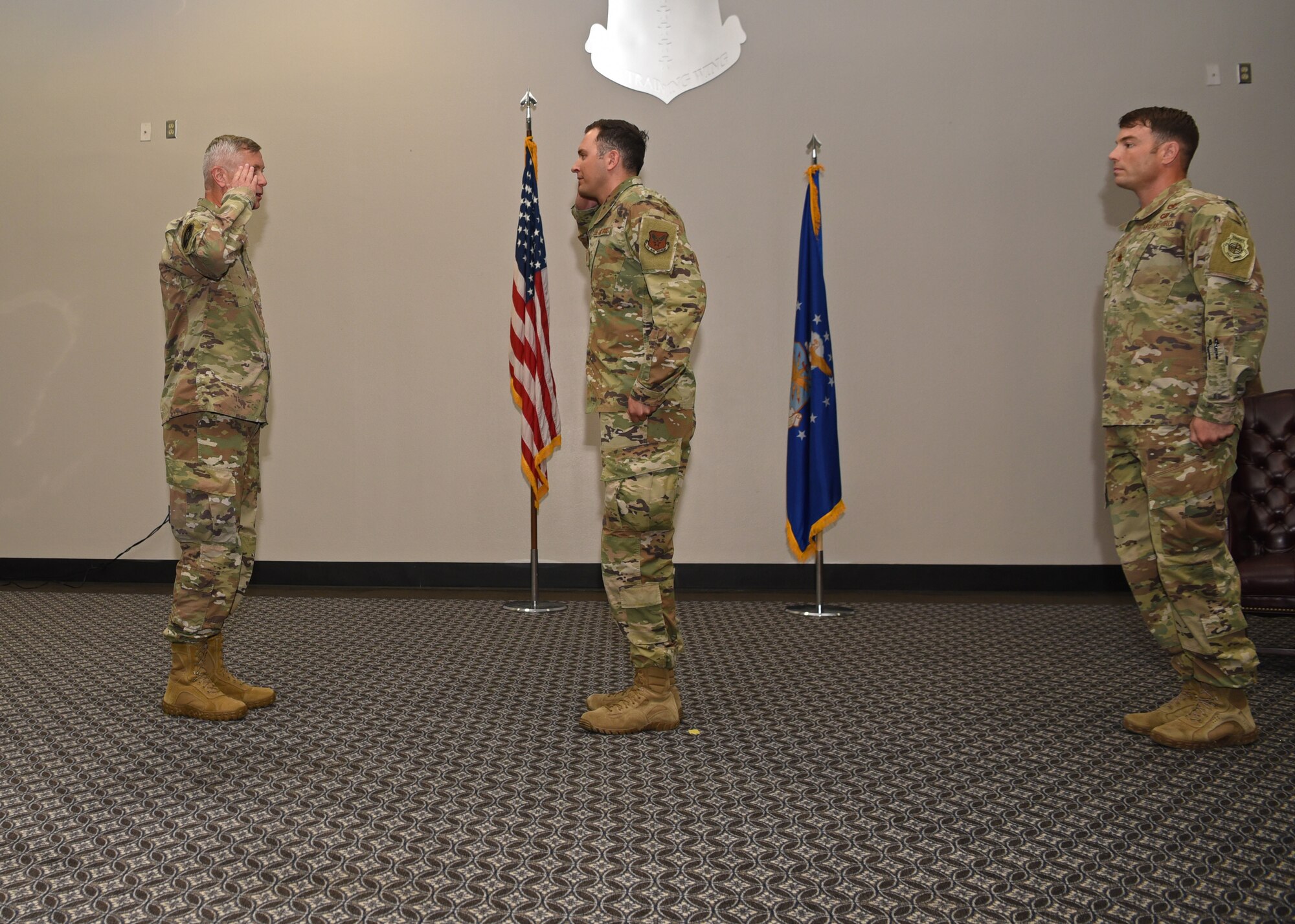 U.S. Air Force Col. Tony England, 17th Mission Support Group commander, salutes Maj. Joseph Newman, 17th Logistics Readiness Squadron incoming commander, as Newman assumes command during the 17th LRS Change of Command Ceremony at the event center on Goodfellow Air Force Base, Texas, July 8, 2020. Newman took over the squadron from Maj. Robbie Walsh, 17th LRS outgoing commander, who led the unit for the past two years as the former 17th LRS commander. (U.S. Air Force photo by Airman 1st Class Abbey Rieves)