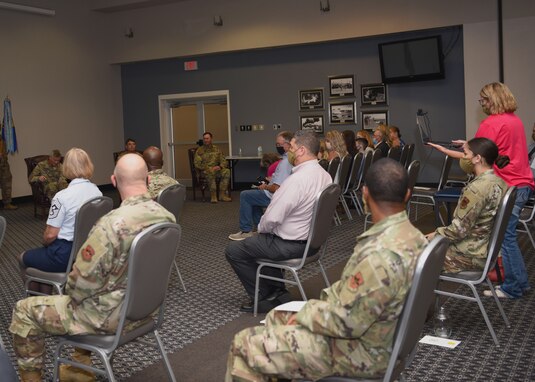 Members and associates of the base, physically and virtually attend the 17th Logistics Readiness Squadron Change of Command Ceremony at the event center on Goodfellow Air Force Base, Texas, July 8, 2020. With COVID-19 precautions in place, the 17th LRS welcomed their incoming commander, Maj. Joseph Newman, and thanked 17th LRS outgoing commander, Maj. Robbie Walsh, for his hard work and dedication. (U.S. Air Force photo by Airman 1st Class Abbey Rieves)