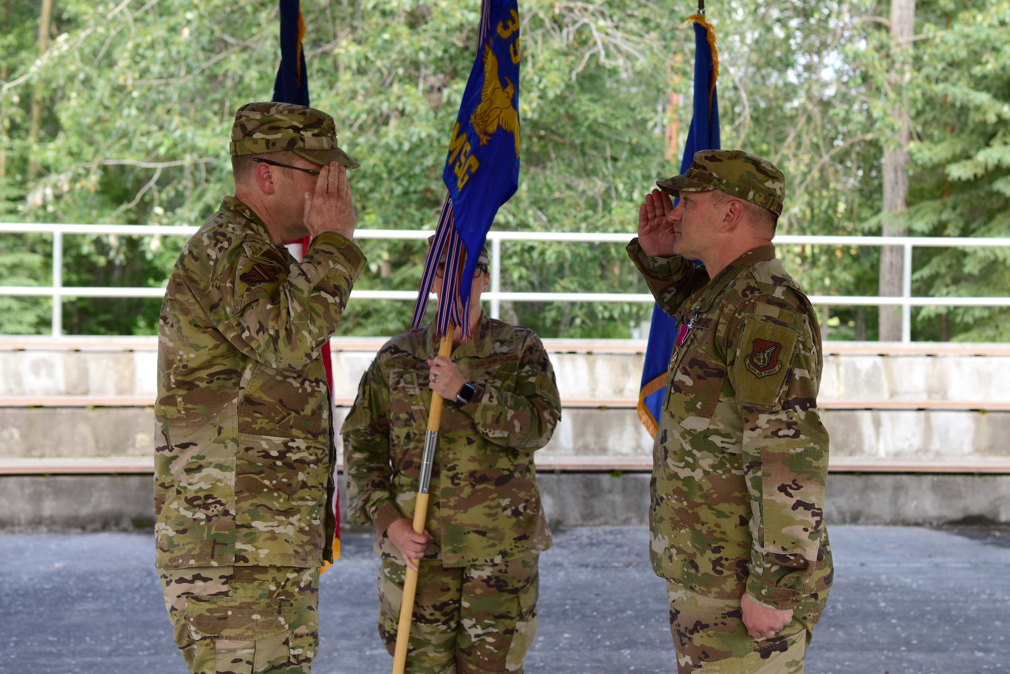 U.S. Air Force Col. Chad Bondurant (right) salutes Col. Shawn Anger, the 354th Fighter Wing commander, signifying his relinquishment of command of the 354th Mission Support Group during a ceremony, July 8, 2020.