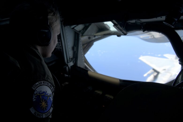 U.S. Air Force Staff Sgt. Erica Lawson, 909th Aerial Refueling Squadron boom operator, conducts air-to-air refueling with a 67th Fighter Squadron F-15C Eagle during a training exercise July 8, 2020, off the coast of Okinawa, Japan. The 909th ARS is the premier force for air refueling U.S. and allied aircraft during contingencies and humanitarian missions throughout the U.S. Indo-Pacific Theater. USINDOPACOM has the capacity to conduct training and exercises focused on the full spectrum of military operations, from combat to humanitarian assistance and disaster relief, anywhere throughout the Indo-Pacific region. (U.S. Air Force photo by Airman 1st Class Rebeckah Medeiros)