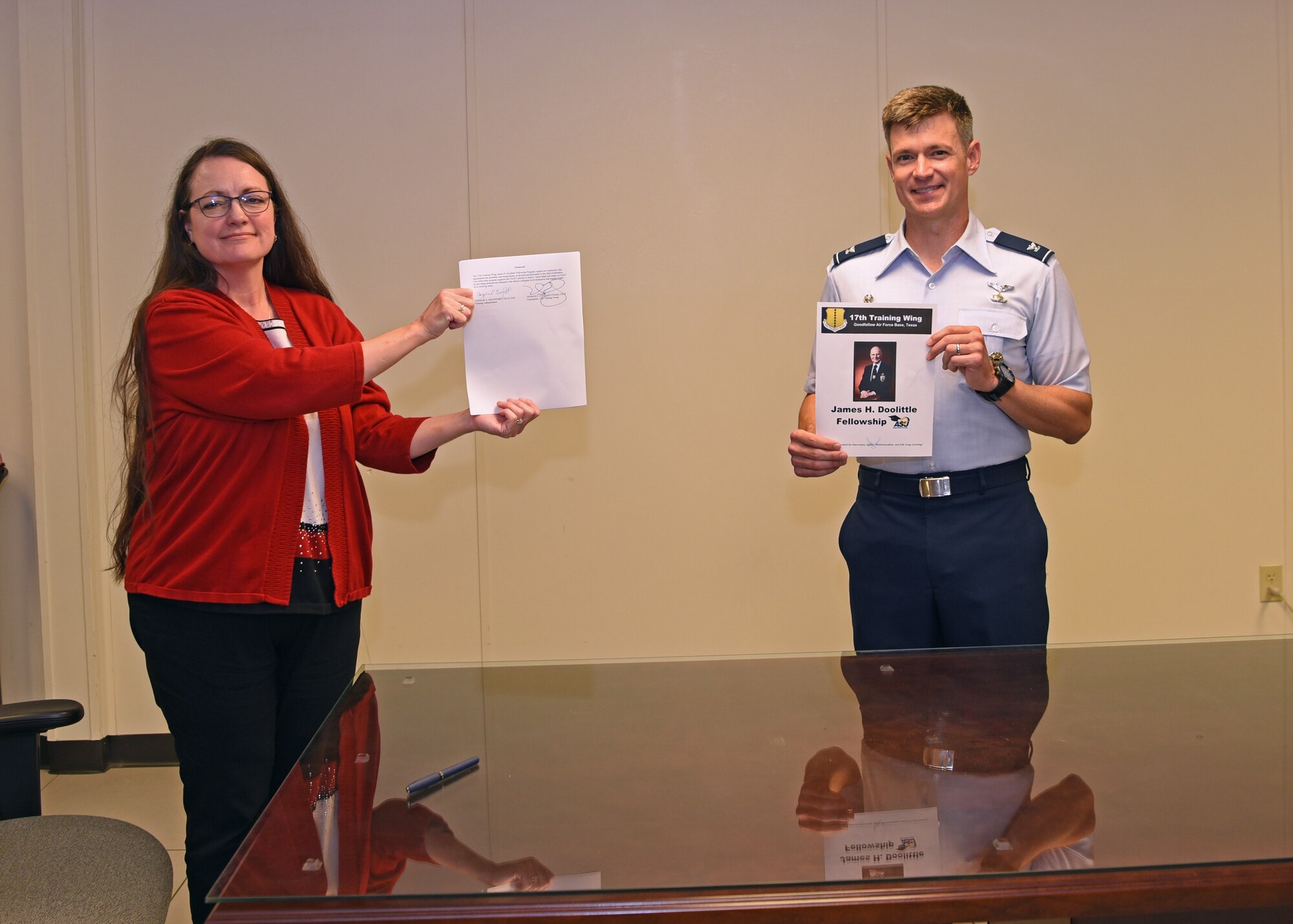 The 17th Training Group Director of Education Angelic Crawford and U.S. Air Force Col. Thomas Coakley, 17th TRG commander, presented the signed James H. Doolittle Fellowship Program memorandum of understanding at the Brandenburg Hall, on Goodfellow Air Force Base, Texas, June 16, 2020. This fellowship program supports the National Defense Strategy to build a more lethal and ready Air Force, by providing professional educators who deliver