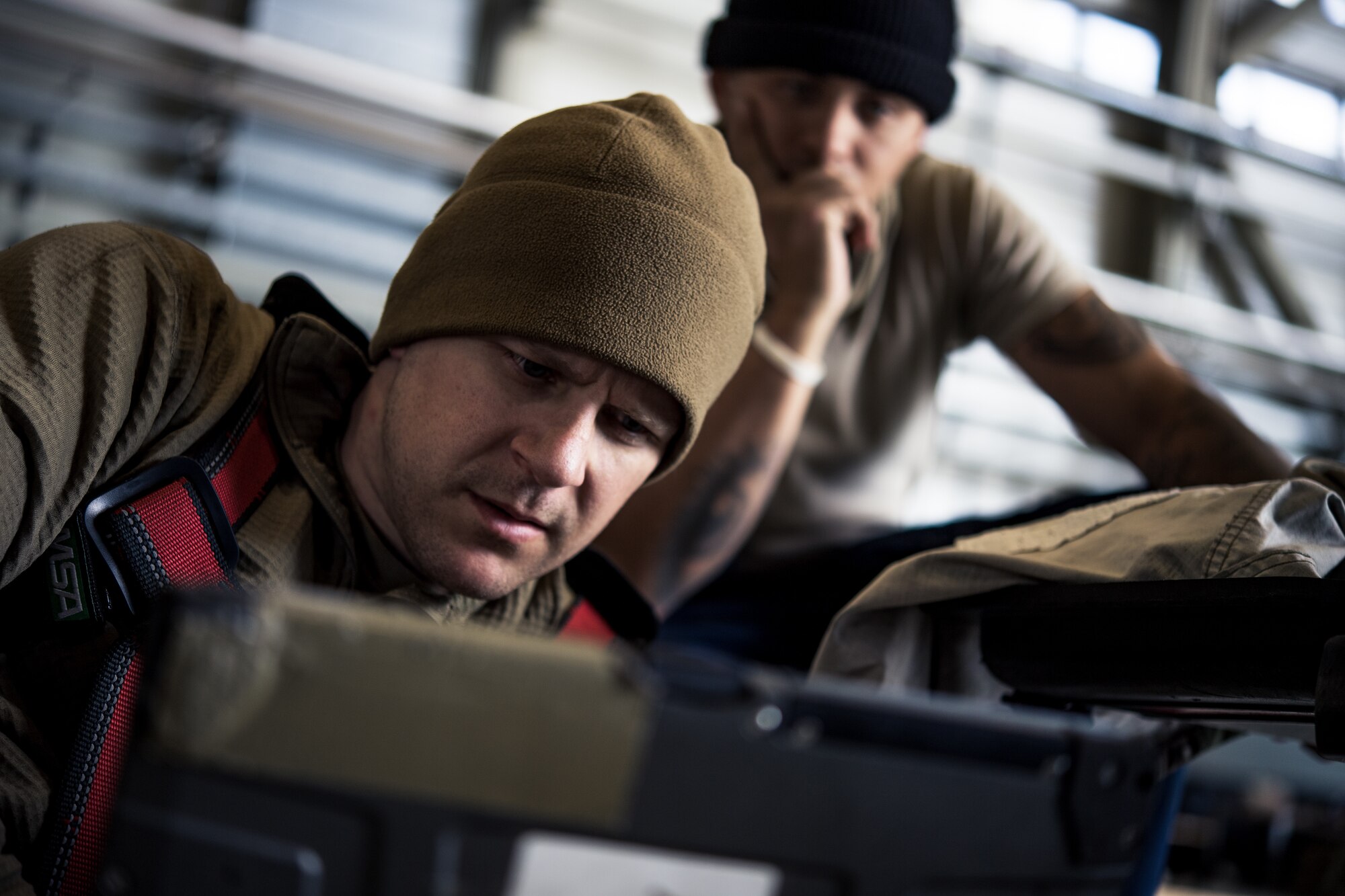 Photo of Airmen looking at computer