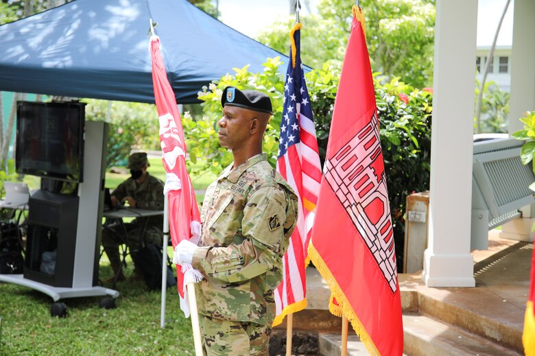 Former Pacific Ocean Division Command Sgt. Maj. Patrickson Toussaint prepares to place the division colors during a Change of Command and Responsibility Ceremony on Fort Shafter, Hawaii, July 8.