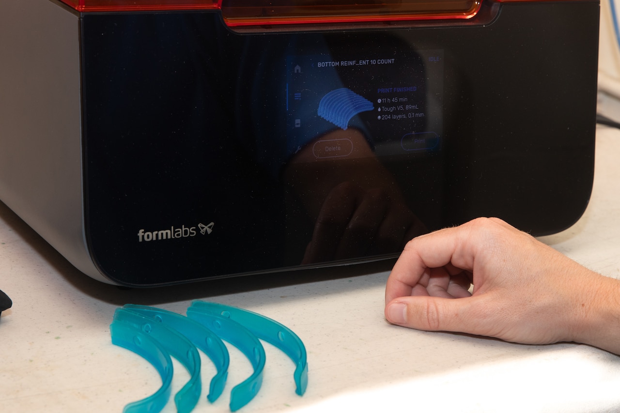 A machine that is part of the 3-D printing process.
