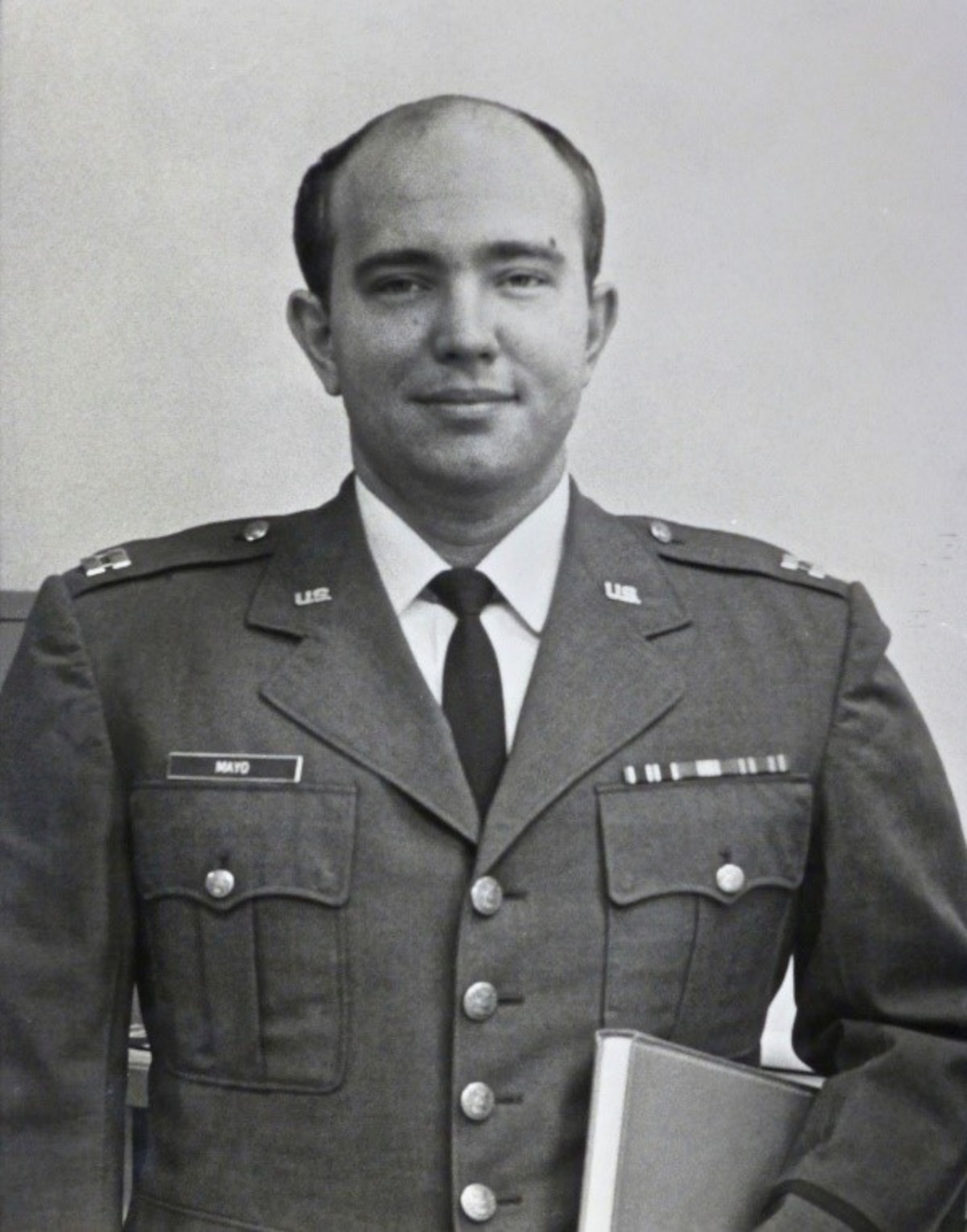 black and white photo of man in military uniform