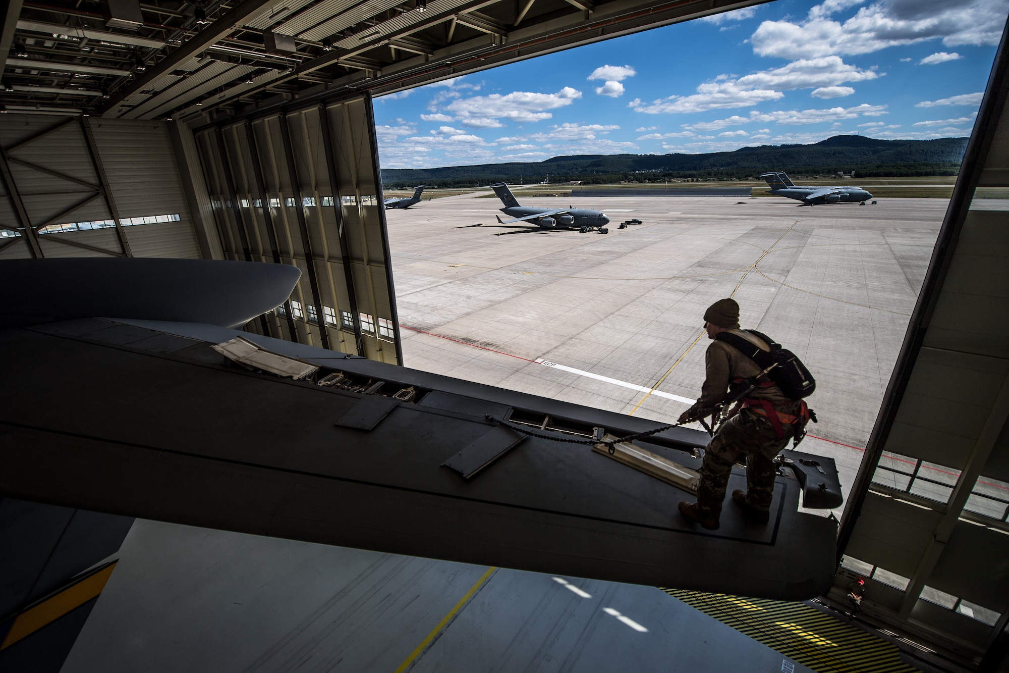 Photo of Airman performing aircraft maintenance