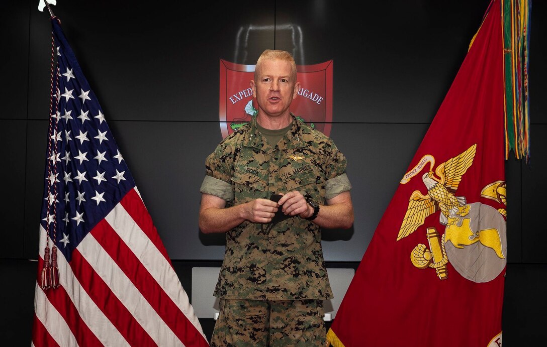 Maj. Gen. Paul J. Rock, outgoing commanding general of 3D Marine Expeditionary Brigade, delivers comments during a change of command ceremony at Camp Courtney, July 10, 2020. Rock relinquished command to Brig. Gen. Kyle B. Ellison. Rock's next assignment will be Director, Strategy and Plans Division, which falls under Plans, Policies & Operations, Headquarters Marine Corps.