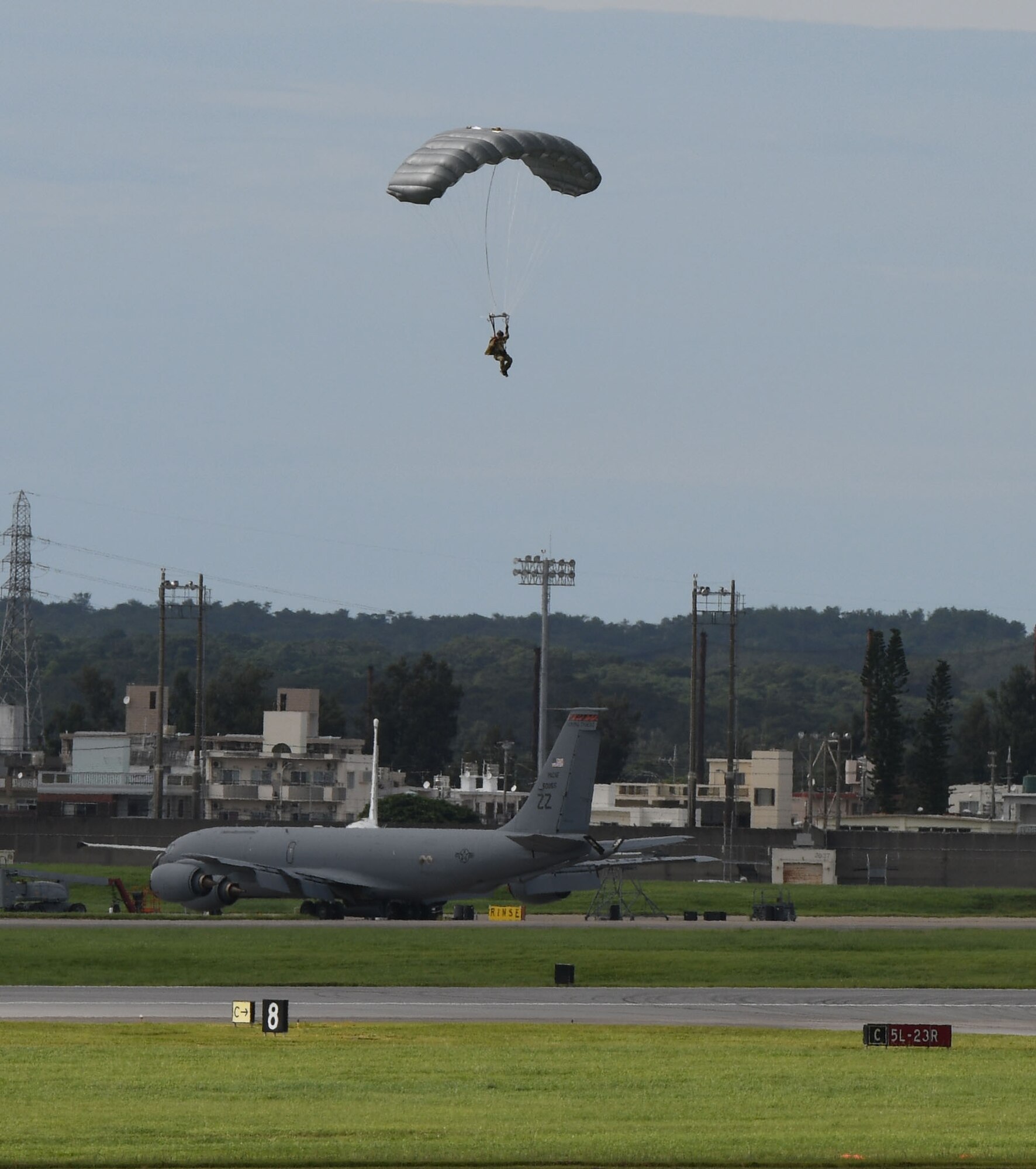 Air Force servicemembers conduct paradrop training at the Ridout drop zone July 9, 2020, on Kadena Air Base, Japan. All training on Kadena AB is conducted in accordance with bilateral agreements between the United States and the Government of Japan. Ie Jima is the primary location for overland U.S. military paradrop training in Okinawa. The bilateral agreements allow for the use of Kadena AB as an alternate location when Ie Jima is not available to meet the immediate training needs of U.S. forces.