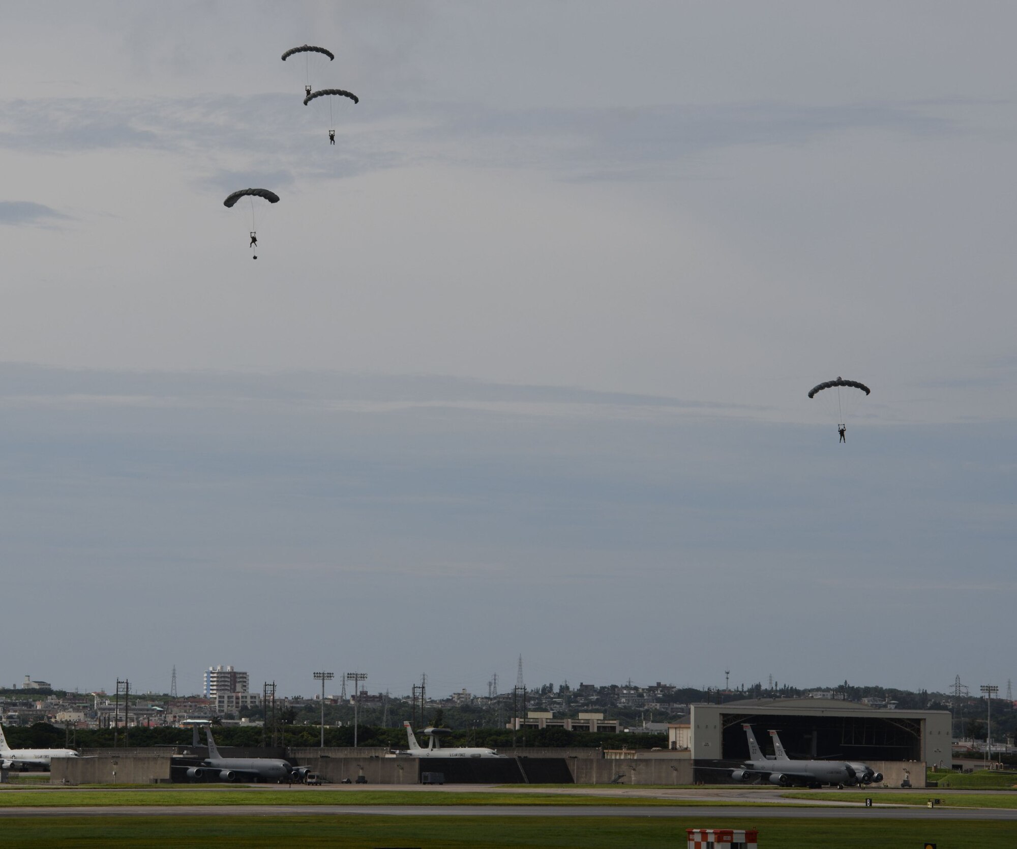 Air Force servicemembers conduct paradrop training at the Ridout drop zone July 9, 2020, on Kadena Air Base, Japan. All training on Kadena AB is conducted in accordance with bilateral agreements between the United States and the Government of Japan. Ie Jima is the primary location for overland U.S. military paradrop training in Okinawa. The bilateral agreements allow for the use of Kadena AB as an alternate location when Ie Jima is not available to meet the immediate training needs of U.S. forces.