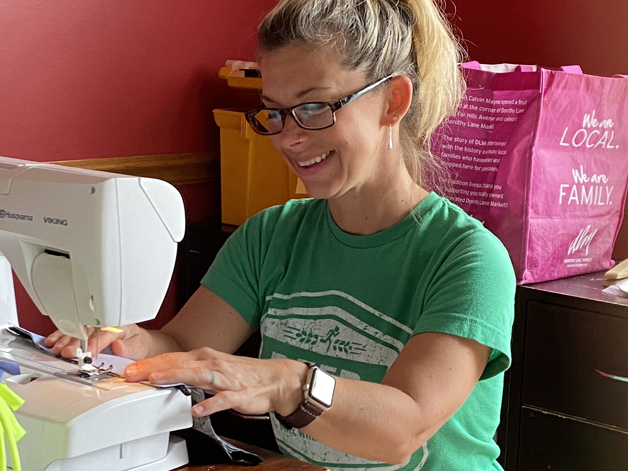 Molly Kirstein, wife of C-17 pilot Capt. Nathan Kirstein, 89th Airlift Squadron, sews face masks for members of the 89th AS. Mrs. Kirstein decided to help by making masks for members of her husband's squadron when she learned her husband had an overseas mission in mid-March.