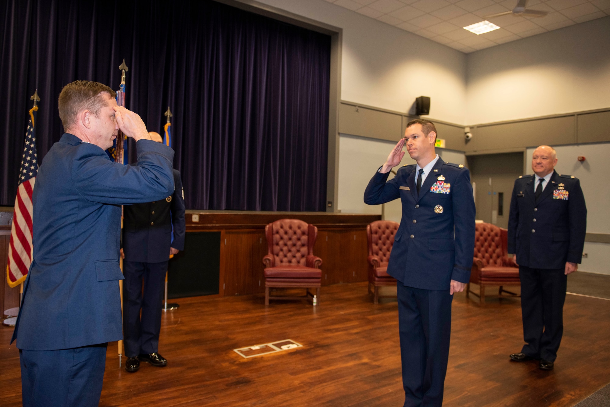 U.S. Air Force Col. Jon Hannah (left), 422d Air Base Group commander, and Maj. Timothy Kirchner (right), 422nd Air Base Squadron incoming commander, salute during a change of command ceremony at RAF Croughton, England, July 9, 2020. The change of command ceremony is rooted in military history dating back to the 18th century representing the relinquishing of power from one officer to another. (U.S. Air Force photo by Airman 1st Class Jennifer Zima)