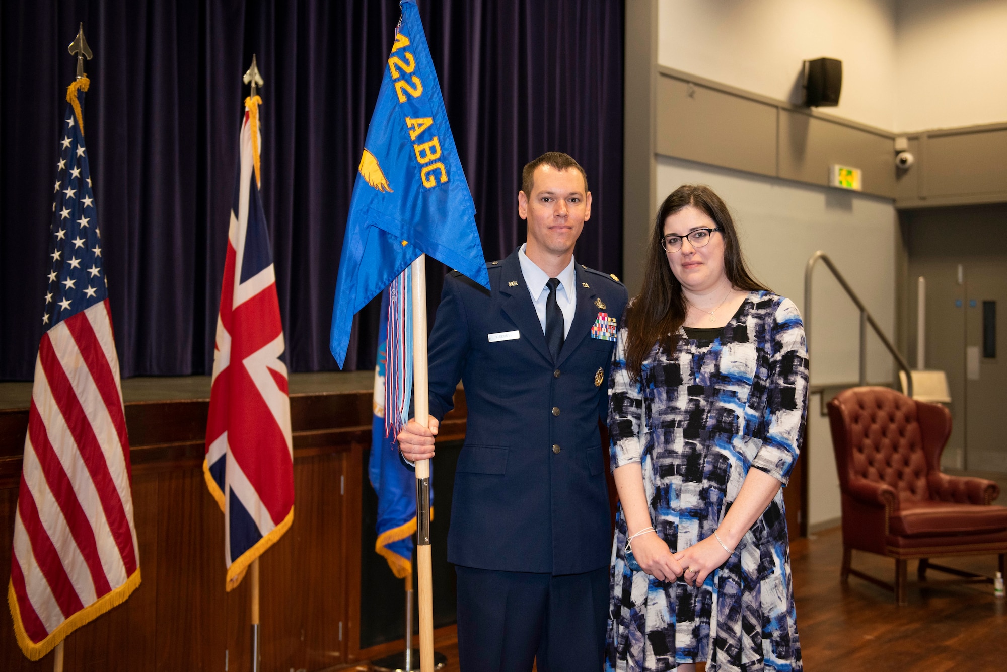 U.S. Air Force Maj. Timothy Kirchner, 422nd Air Base Squadron commander, poses for a photo with his wife, Lyndsey Kirchner, during a change of command ceremony at RAF Croughton, England, July 9, 2020. The change of command ceremony is rooted in military history dating back to the 18th century representing the relinquishing of power from one officer to another. (U.S. Air Force photo by Airman 1st Class Jennifer Zima)