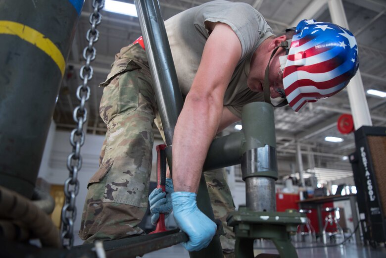 Staff Sgt. Christopher Vetsch, 22nd Maintenance Squadron aerospace ground equipment craftsman, assembles a 30-ton tripod jack July 7, 2020, at McConnell Air Force Base, Kansas. Vetsch’s job was to disassemble the tripod jack to ensure there was no corrosion and keep the equipment running. Tripod jacks are used to lift of aircraft off the ground to perform maintenance and operational checks on landing gear components. (U.S. Air Force photo by Senior Airman Alexi Bosarge)