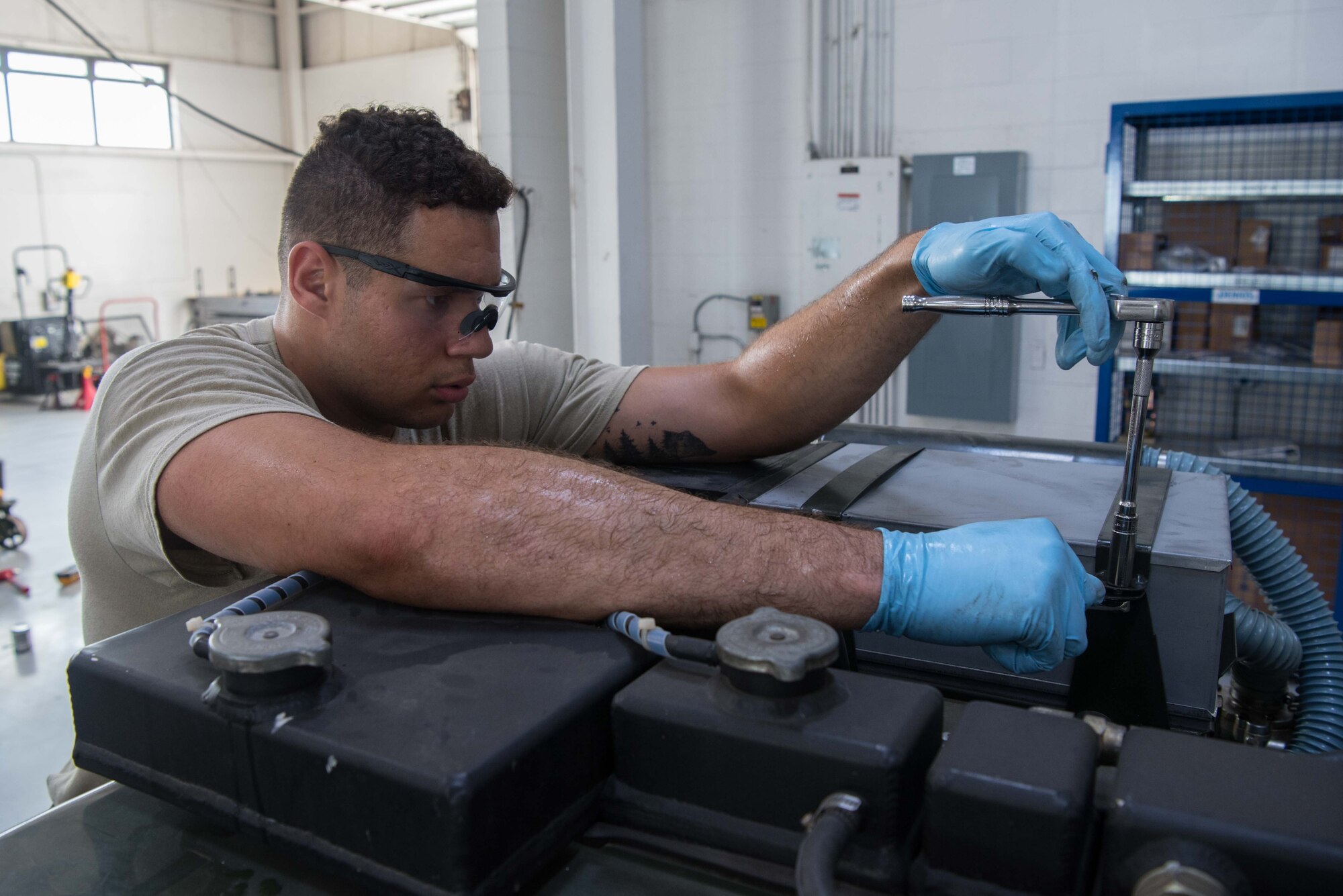 Senior Airman Nicholas Summit, 22nd Maintenance Squadron aerospace ground equipment journeyman, screws a bolt into a self-generating nitrogen cart July 7, 2020, at McConnell Air Force Base, Kansas. AGE has a total of 70 Airmen that are responsible for providing all hydraulic, pneumatic and power support equipment for servicing aircraft on the flightline. (U.S. Air Force photo by Senior Airman Alexi Bosarge)