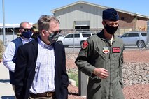 U.S. Deputy Secretary of Defense David L. Norquist walks alongside Col. Stephen R. Jones, 432nd Wing/432nd Air Expeditionary Wing commander, during a visit to Creech Air Force Base.