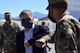 U.S. Deputy Secretary of Defense David L. Norquist walks alongside Col. Stephen R. Jones, 432nd Wing/432nd Air Expeditionary Wing commander, during a visit to Creech Air Force Base, Nevada.