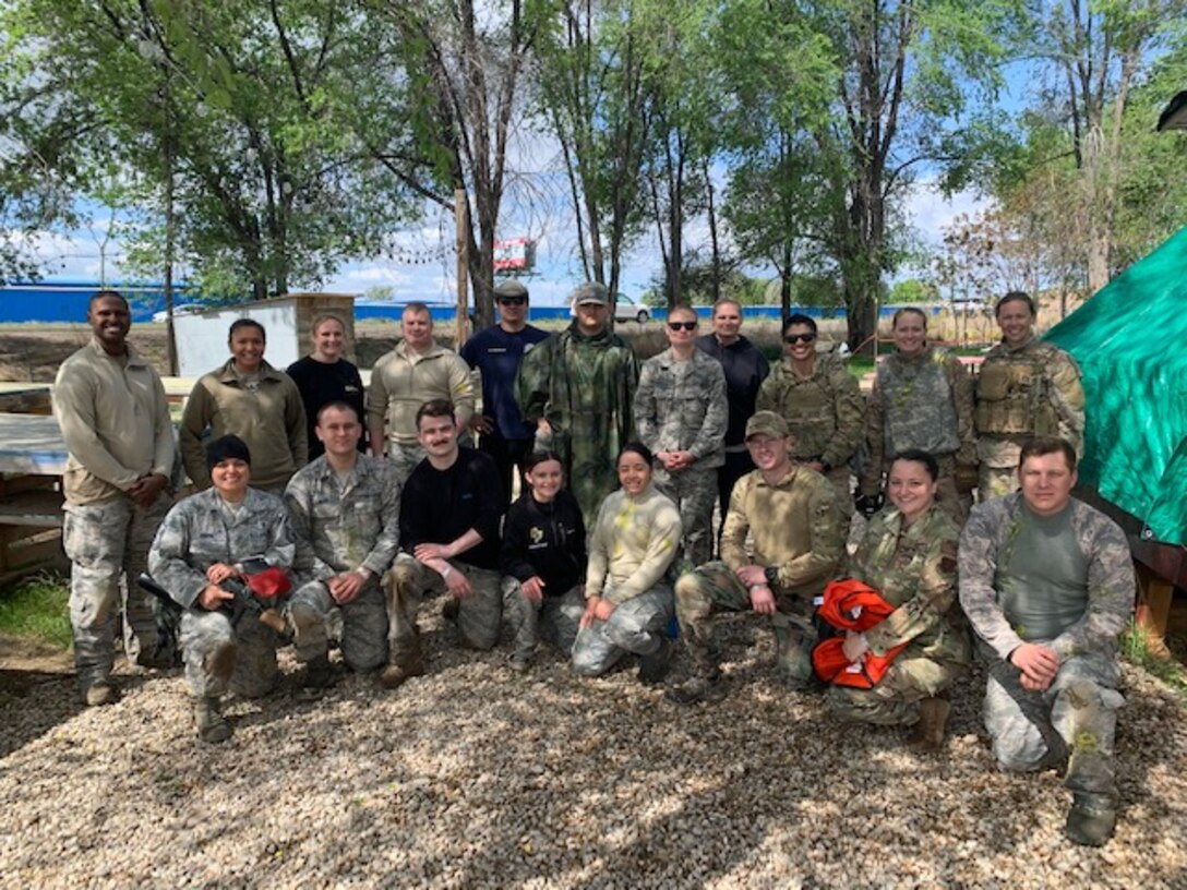 U.S. Air Force Airmen take a group photo after a combat medical care exercise near Mountain Home Air Force Base, Idaho. The 366th Operations Medical Readiness Squadron created a field response training program to ensure Air Force medics receive realistic care-under-fire training so they’re ready to save lives down-range. (Courtesy photo)