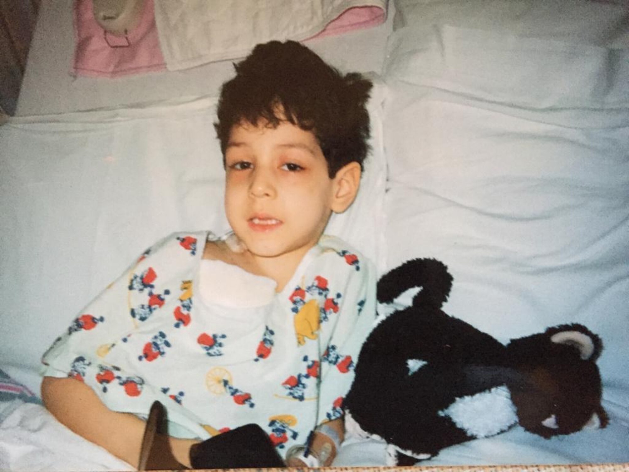 Airman 1st Class Isaiah A. Nieves, 2nd Maintenance Squadron aerospace ground equipment journeyman, sits in a hospital bed as a child. Nieves was diagnosed with Acute Lymphoblastic Leukemia at the age of four. (Courtesy photo)