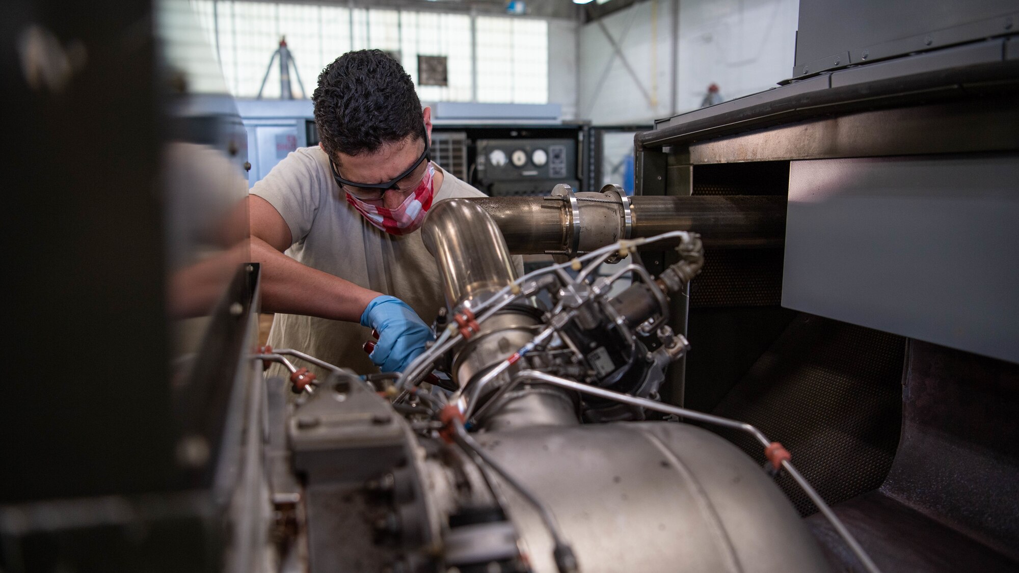 Airman 1st Class Isaiah E. Nieves, 2nd Maintenance Squadron aerospace ground equipment journeyman, services a -95 start cart at Barksdale Air Force Base, La., June 10, 2020. Nieves was diagnosed with Acute Lymphoblastic Leukemia at the age of four. After becoming cancer free at the age of 18, Nieves began the process of joining the Air Force. (U.S. Air Force photo by Airman 1st Class Jacob B. Wrightsman)