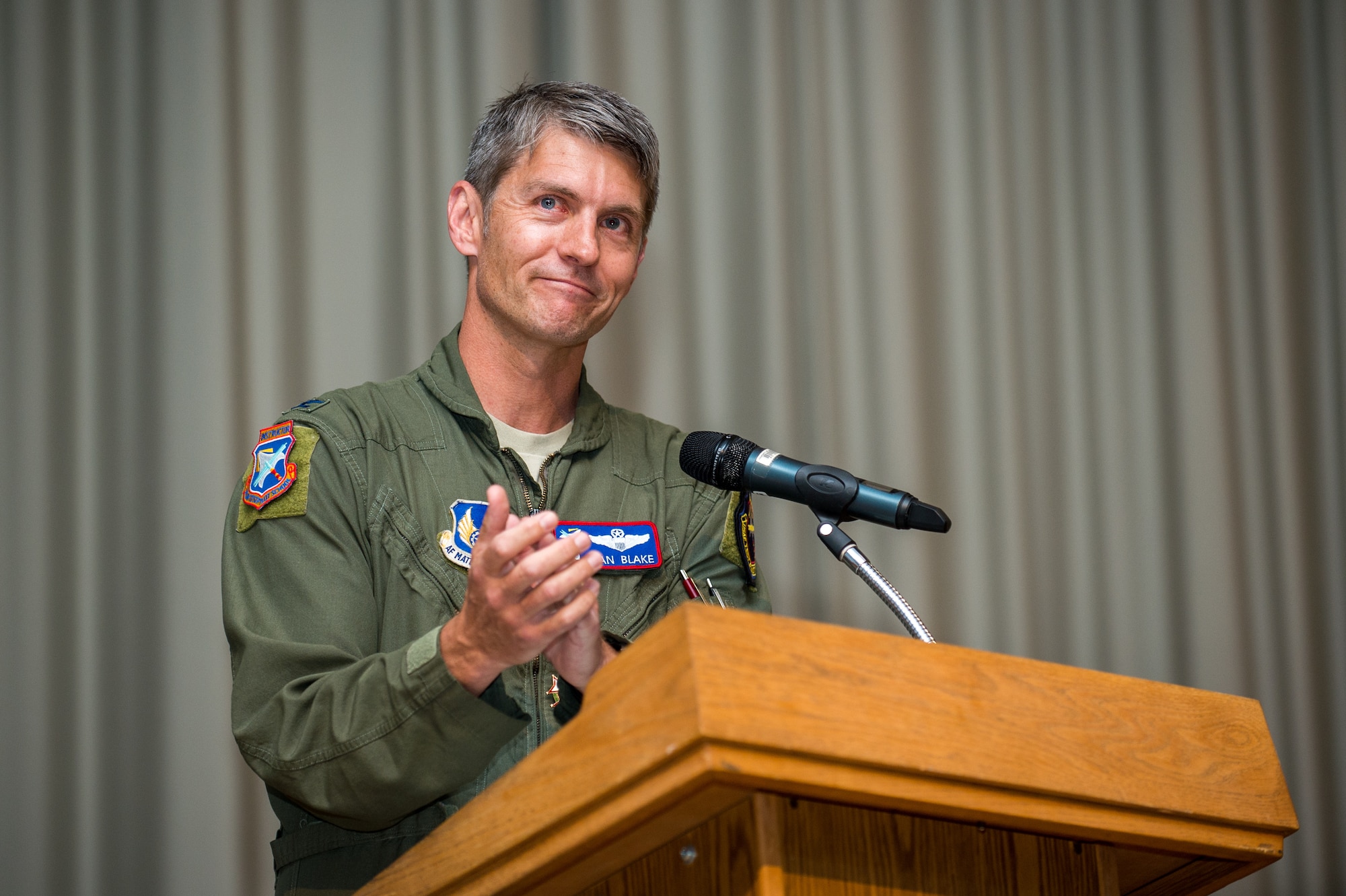Col. Ryan Blake, the former Test Pilot School Commandant, provides his farewell remarks during a Change of Command ceremony at Edwards Air Force Base, California, July 10. (Air Force photo by Ethan Wagner)