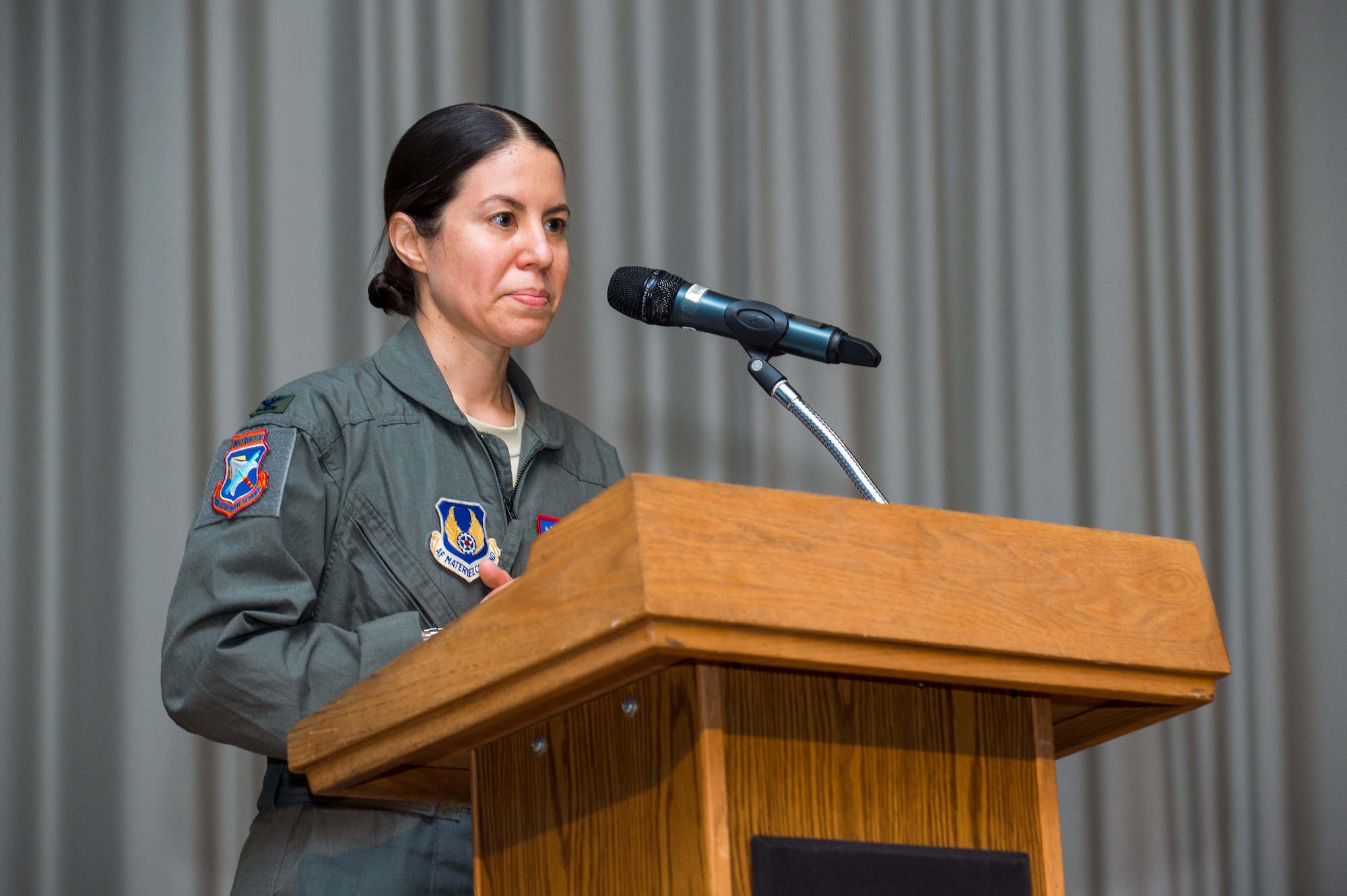 Col. Sebrina Pabon, Test Pilot School Commandant, provides her remarks during a Change of Command ceremony at Edwards Air Force Base, California, July 10. Pabon became the first female and flight test engineer to be named commandant of the school. (Air Force photo by Ethan Wagner)