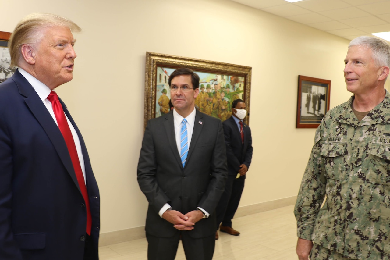 President Donald J. Trump talks with Defense Secretary Dr. Mark T. Esper and Navy Adm. Craig Faller, commander of U.S. Southern Command.