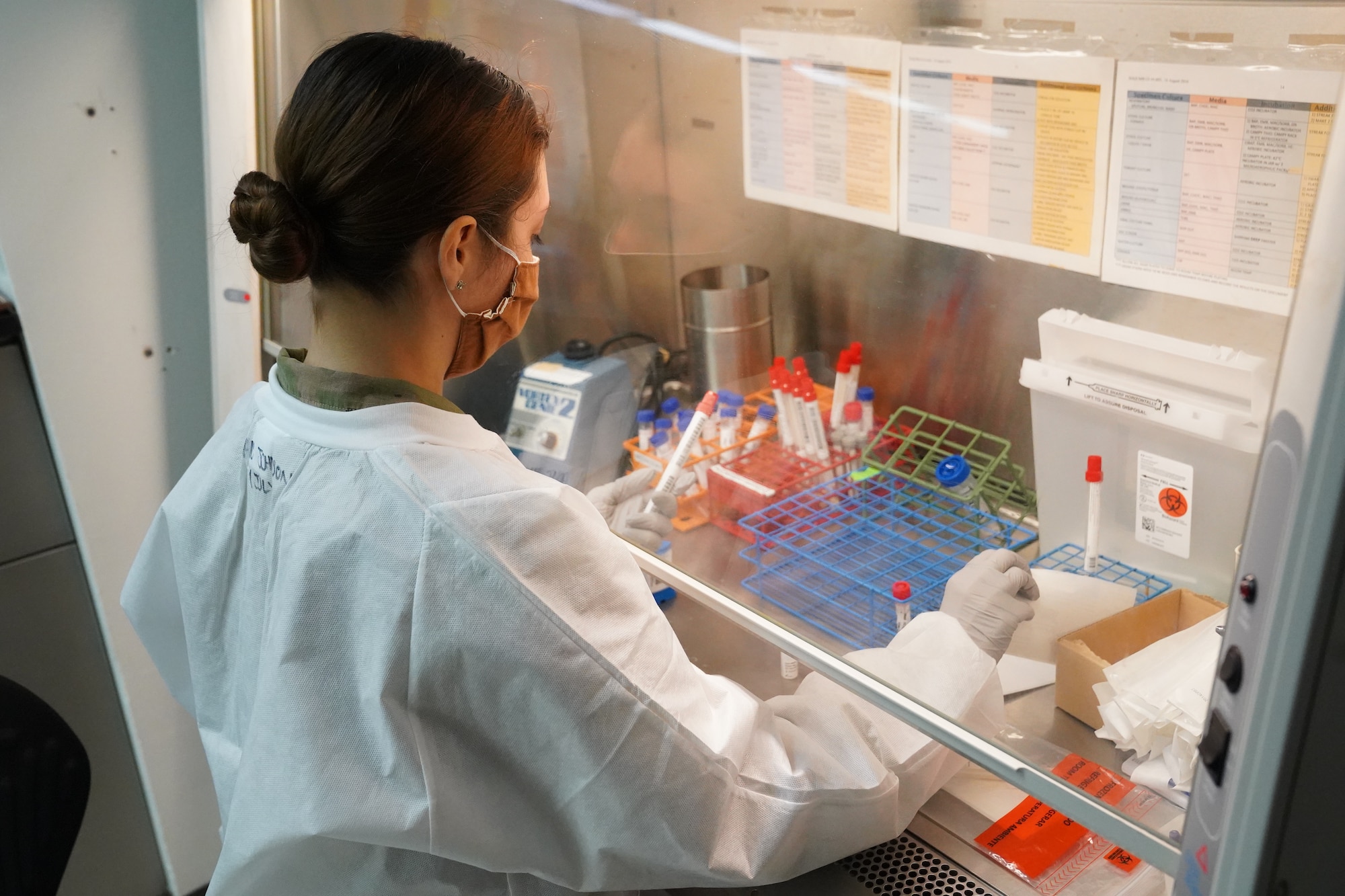 U.S. Air Force Airman 1st Class Alexandria Johnson, 81st Diagnostic and Therapeutics Squadron lab technician, prepares a COVID-19 sample for testing inside the Keesler Medical Center at Keesler Air Force Base, Mississippi, July 1, 2020. The Microbiology Department has been working to get fast, efficient, and accurate COVID test results to their
patients. (U.S. Air Force photo by Airman 1st Class Spencer Tobler)