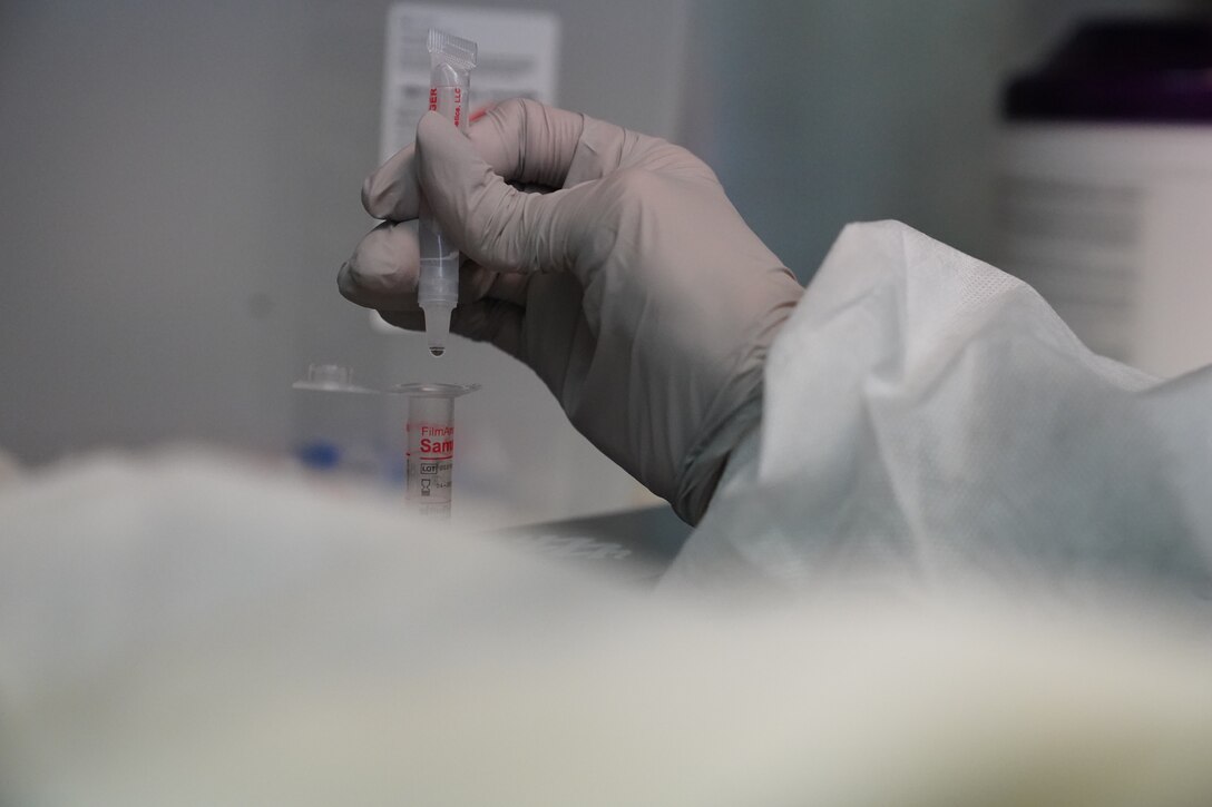 U.S. Air Force Airman 1st Class Alexandria Johnson, 81st Diagnostic and Therapeutics Squadron lab technician, prepares a COVID-19 sample for testing inside the Keesler Medical Center at Keesler Air Force Base, Mississippi, July 2, 2020. The Microbiology Department has been working to get fast, efficient, and accurate COVID test results to their
patients. (U.S. Air Force photo by Airman 1st Class Spencer Tobler)