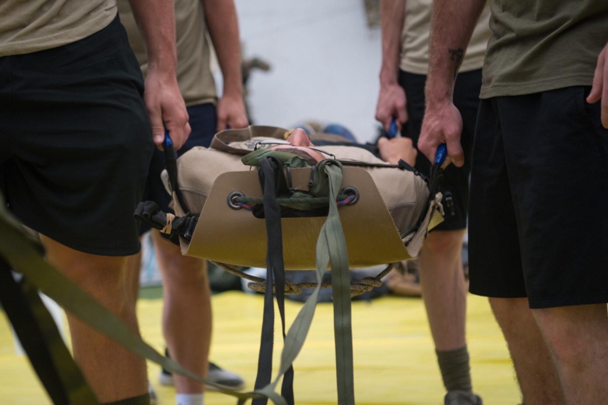 Simulated partner forces learn how to package and transfer patients using a portable stretcher