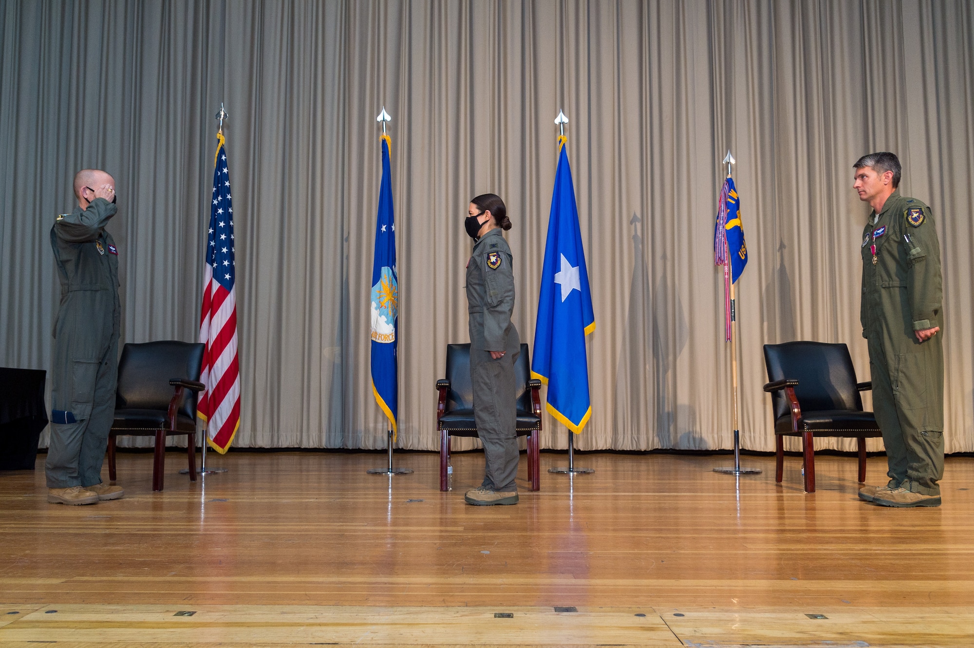 Col. Sebrina Pabon, Test Pilot School Commandant, salutes Brig. Gen. Matthew Higer, 412th Test Wing Commander, as she becomes the newest school commandant during a Change of Command ceremony at Edwards Air Force Base, California, July 10. (Air Force photo by Ethan Wagner)