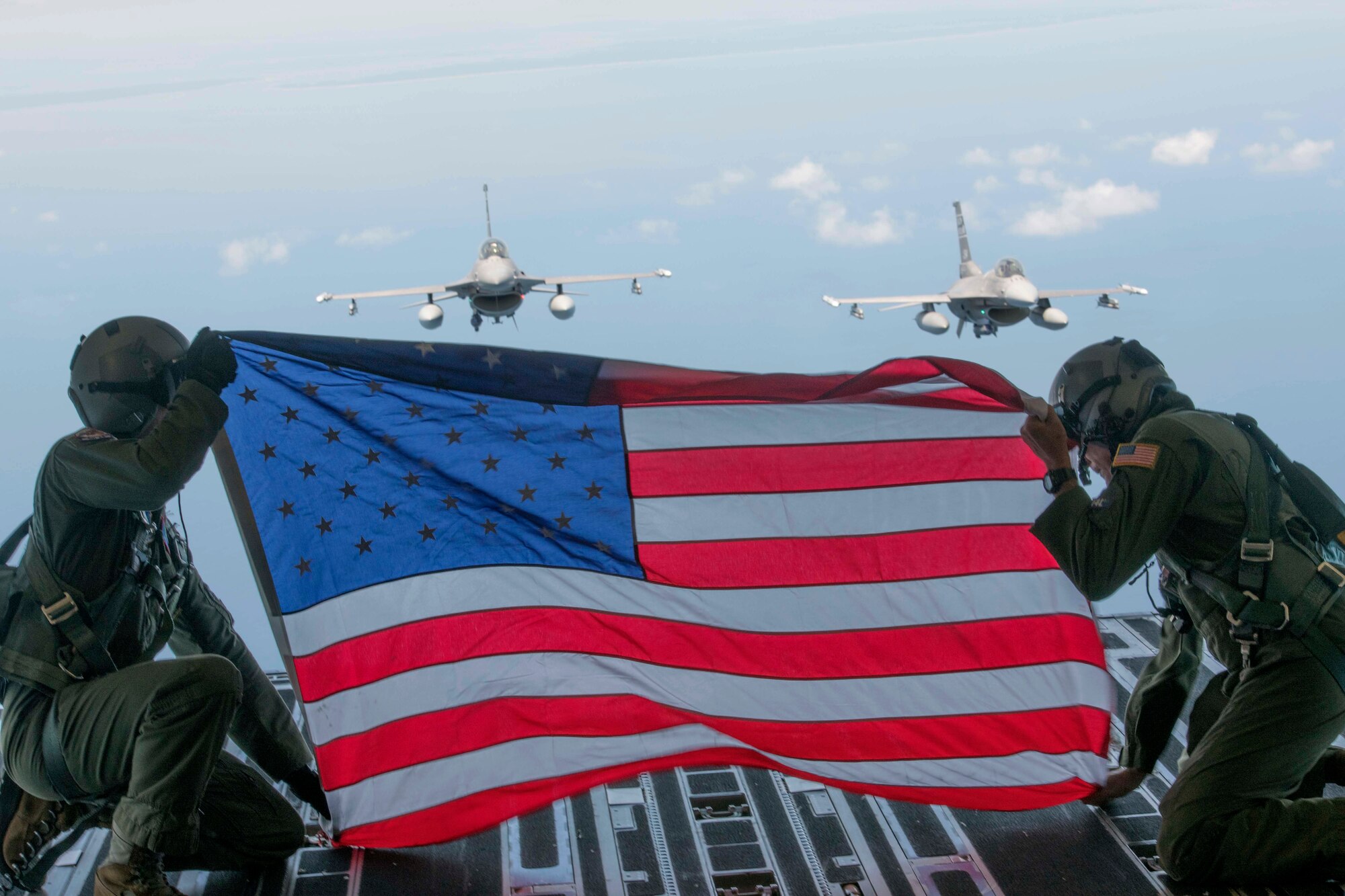 Two F-16 Fighting Falcons from the 169th Fighter Wing, McEntire Joint National Guard Base flew in formation behind the C-17 Globemaster III to honor Schmitz, who was recently killed in an F-16 crash at Shaw AFB.