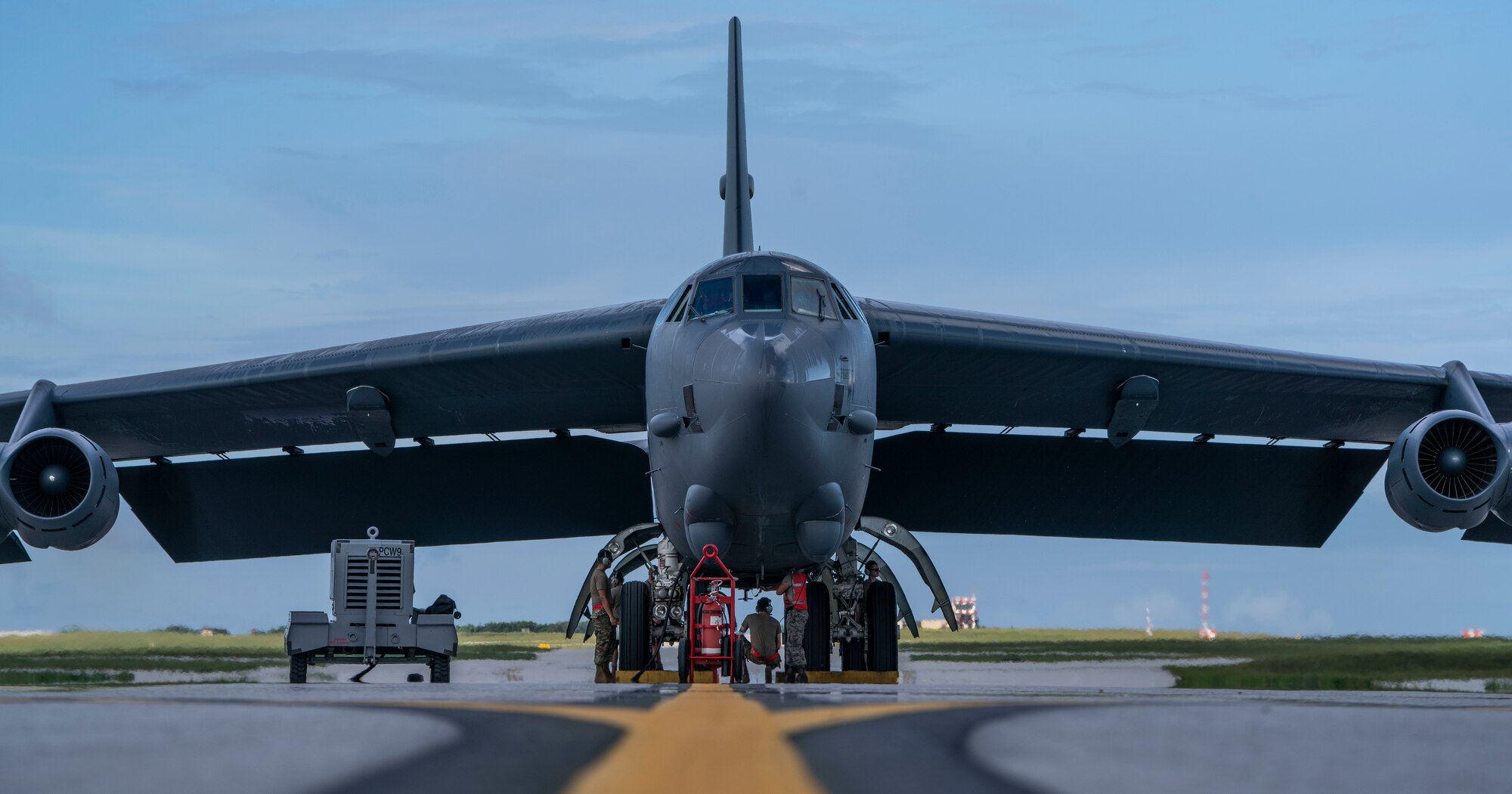 Airmen perform maintenance on a B-52H Stratofortress bomber deployed from Barksdale Air Force Base, La., after it landed at Andersen Air Force Base, Guam, July 4, 2020.