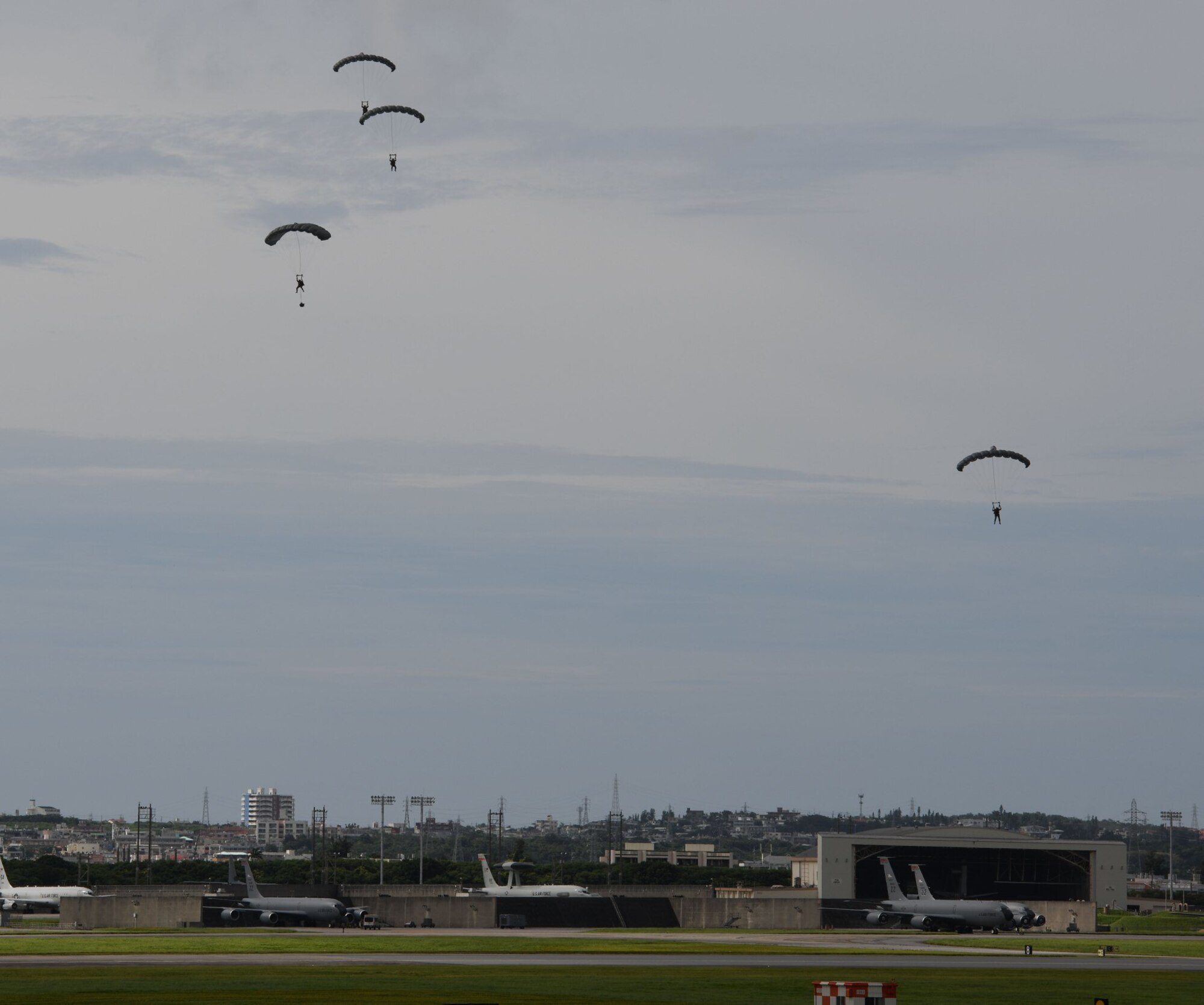 Air Force servicemembers conduct paradrop training at the Ridout drop zone July 9, 2020, on Kadena Air Base, Japan. All training on Kadena AB is conducted in accordance with bilateral agreements between the United States and the Government of Japan. Ie Jima is the primary location for overland U.S. military paradrop training in Okinawa. The bilateral agreements allow for the use of Kadena AB as an alternate location when Ie Jima is not available to meet the immediate training needs of U.S. forces.